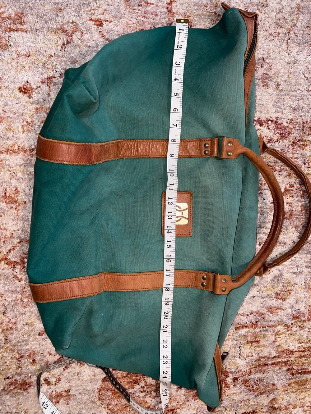 Vintage green duffle bag with leather handles